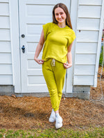 Alyssa standing full body picture with Keziah Lime Joggers and matching Wesley Lime Sweatshirt. 