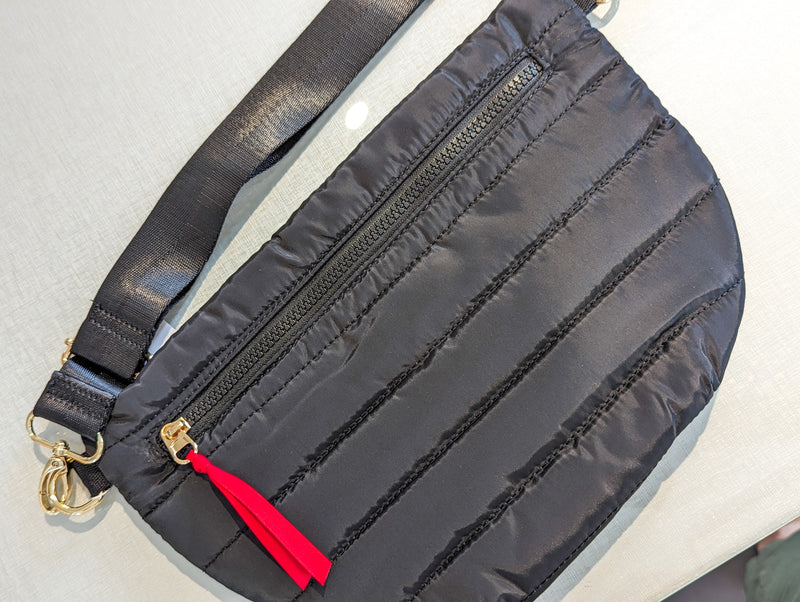 black puff belt bag with front zipper
