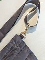 black puff belt bag with front zipper