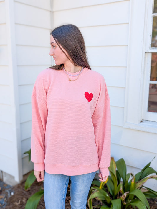 Pink Sweatshirt with Red Heart Graphic