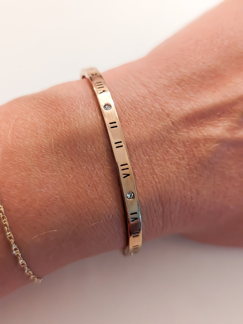 Rose gold colored roman numerals bracelet